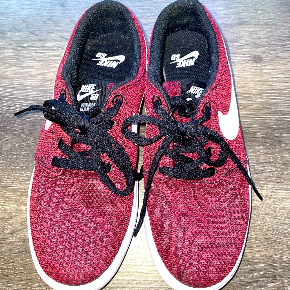 Maroon Nike sneakers